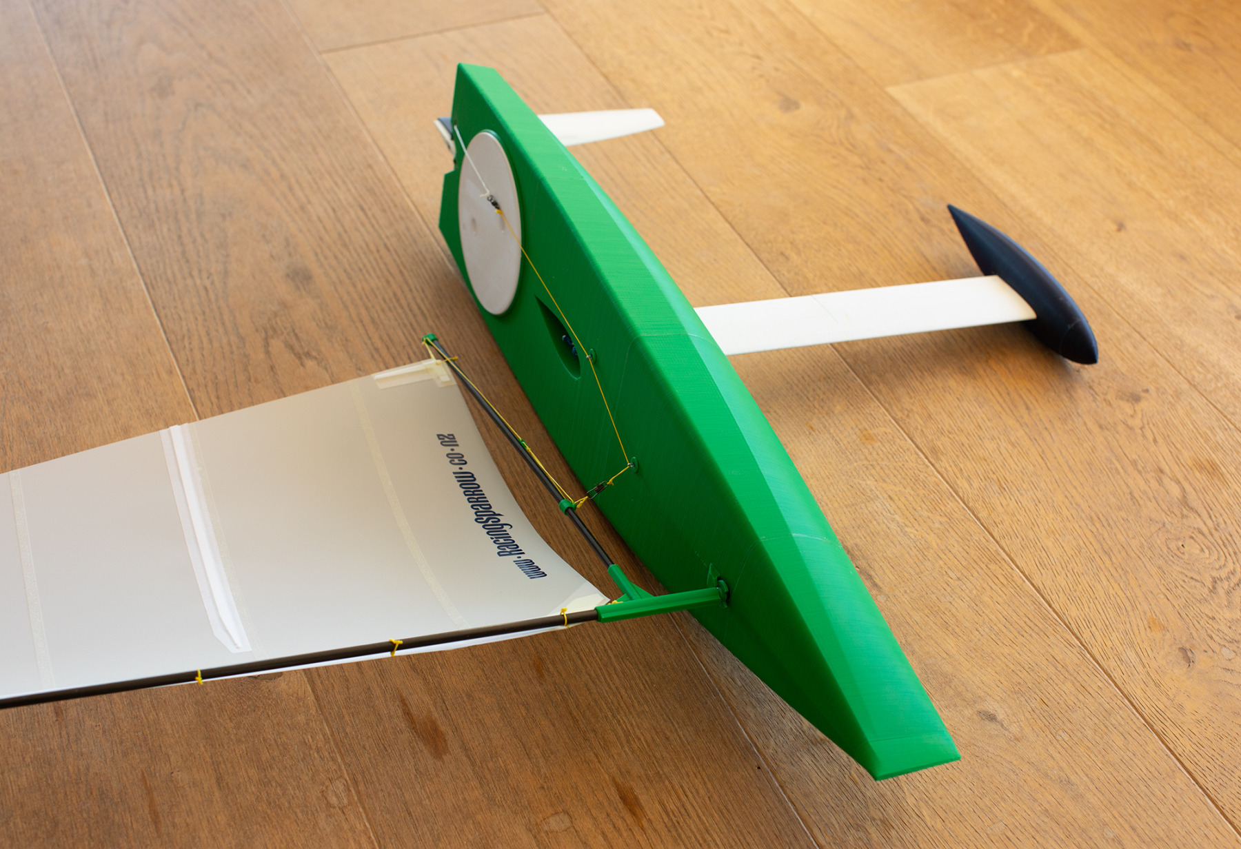 The Racing Sparrow Ranger 695 RC model sail boat lying on her side with sharp modern lines, a fast looking machine!