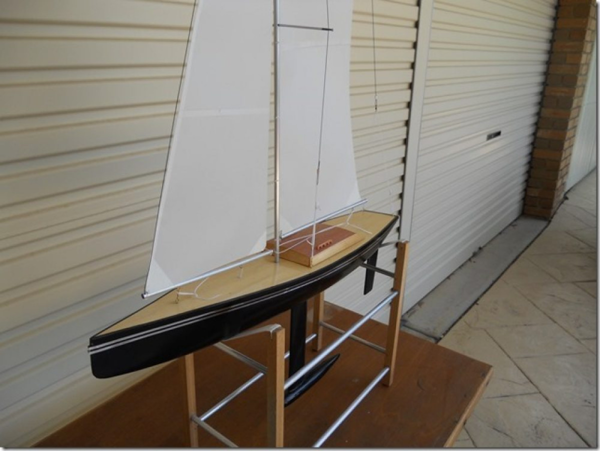 The original black pearl rc yacht with a black hull and wooden decking with wooden hatch, Location: Australia