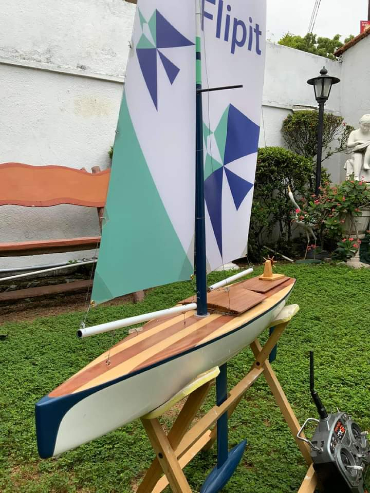 Bright coloured sails on this Racing Sparrow model yacht with a striped wooden deck, Location: Kohuwala, Sri Lanka